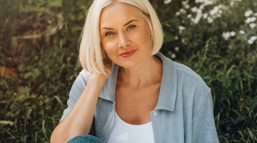 Blonde woman outdoors in nature portrait
